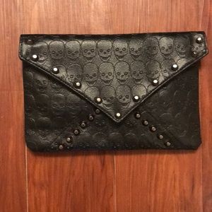 Never used black clutch with skulls and spikes